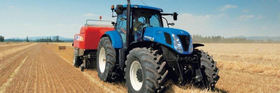 Blue New Holland tractor in a field