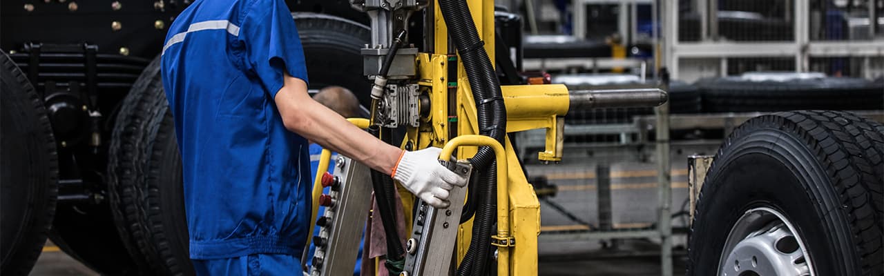 Service technician working on equipment in a shop